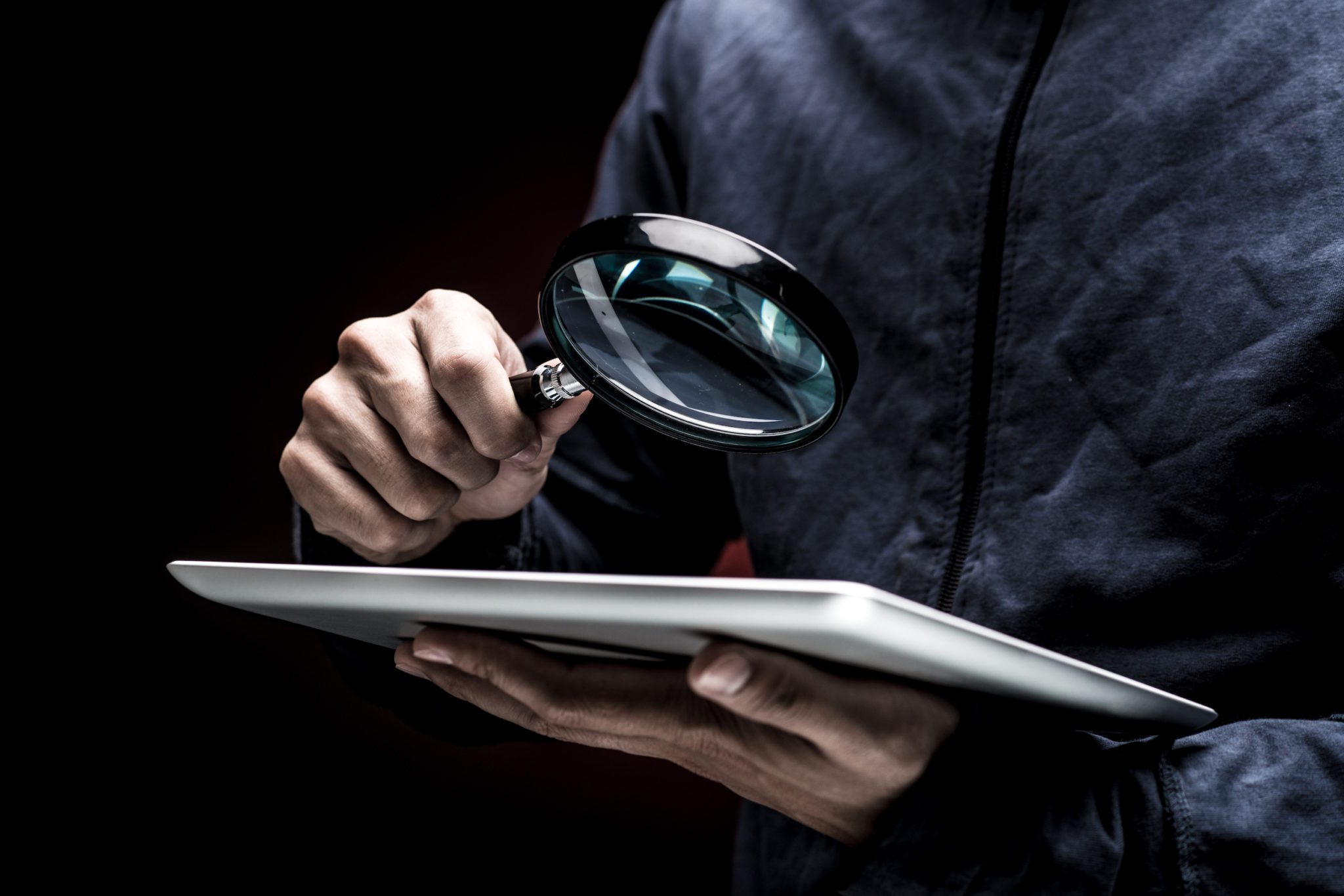 magnifying glass over tablet screen